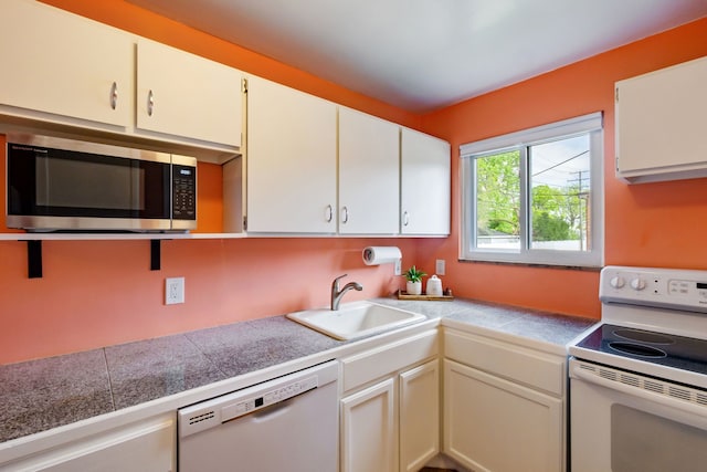 9917 Middlebelt Rd, Livonia, MI 48150 - kitchen with white appliances, tile countertops, a sink, and white cabinetry