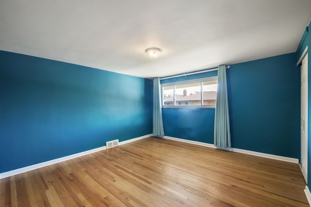 9917 Middlebelt Rd, Livonia, MI 48150 - spare room featuring baseboards and wood finished floors