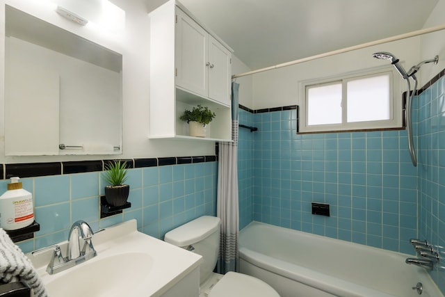 9917 Middlebelt Rd, Livonia, MI 48150 - bathroom featuring shower / bath combo, toilet, tile walls, vanity, and wainscoting