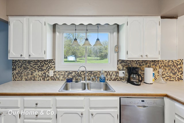 kitchen featuring dishwasher, a sink, white cabinets, and light countertops