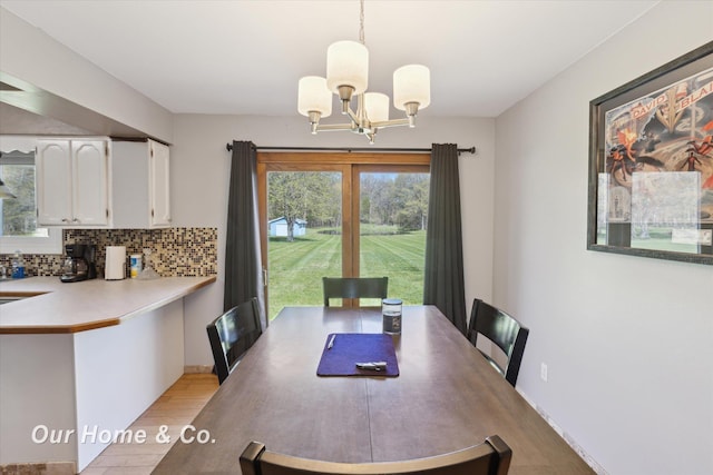 dining room featuring a chandelier and light wood-style floors
