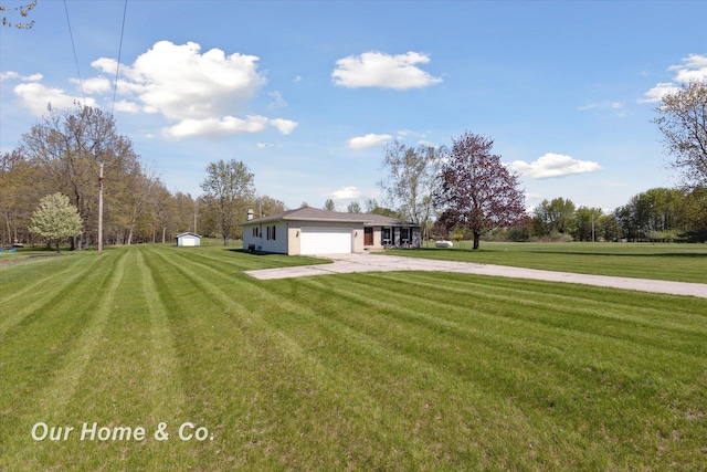 view of front facade featuring concrete driveway, an attached garage, and a front lawn