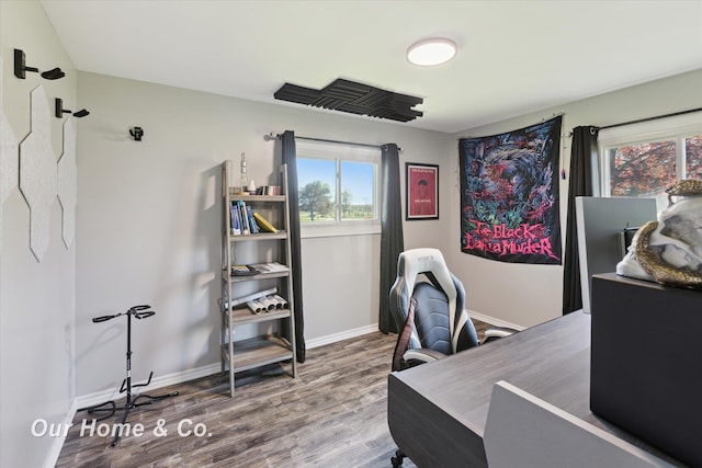 office featuring wood finished floors and baseboards