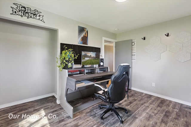 home office featuring wood finished floors and baseboards