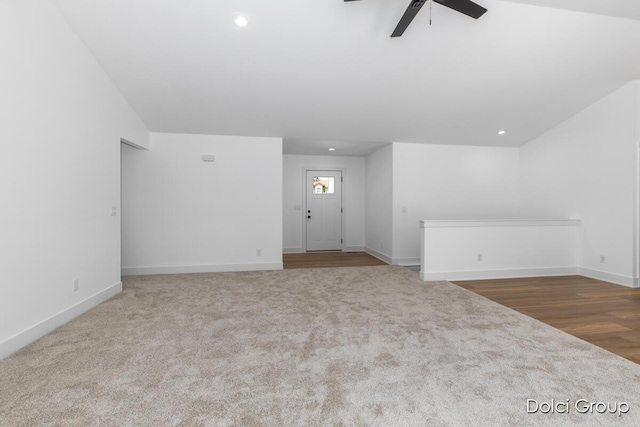 unfurnished living room featuring a ceiling fan, carpet floors, baseboards, and recessed lighting