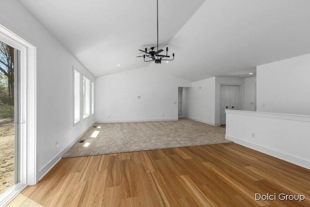 unfurnished living room with light wood-style flooring, vaulted ceiling, baseboards, ceiling fan, and recessed lighting