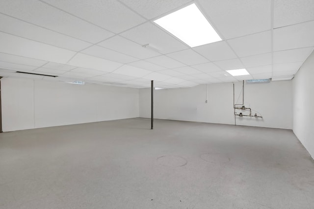 finished basement with a paneled ceiling