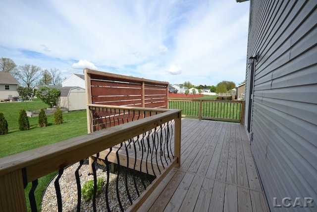1872 Allan St, Adrian, MI 49221 - deck featuring a storage unit, a yard, and an outdoor structure