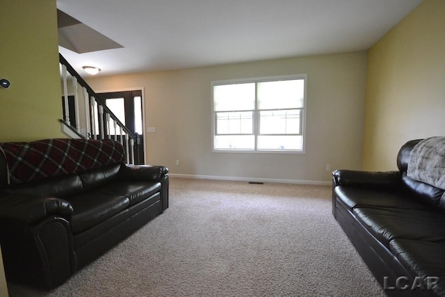 1872 Allan St, Adrian, MI 49221 - carpeted living area with stairs and baseboards