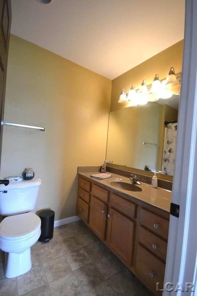 1872 Allan St, Adrian, MI 49221 - full bathroom featuring vanity, baseboards, and toilet