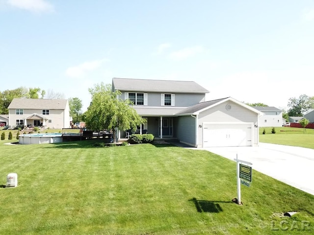 1872 Allan St, Adrian, MI 49221 - traditional-style house with an attached garage, concrete driveway, and a front lawn