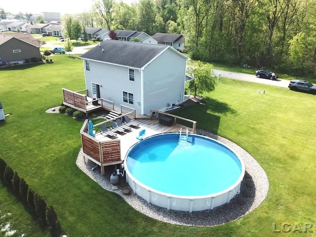 1872 Allan St, Adrian, MI 49221 - outdoor pool featuring a deck and a yard