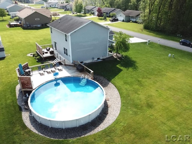 1872 Allan St, Adrian, MI 49221 - swimming pool featuring a deck and a yard