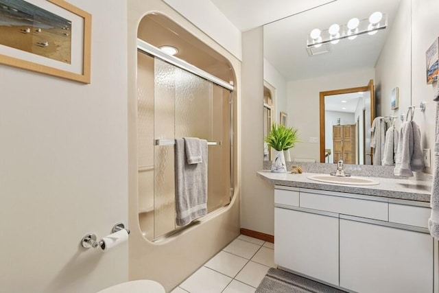 10059 Weko Dr, Bridgman, MI 49106 - bathroom with tile patterned flooring, vanity, and combined bath / shower with glass door