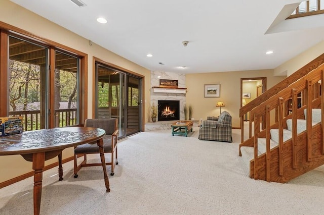 10059 Weko Dr, Bridgman, MI 49106 - carpeted living area with plenty of natural light, recessed lighting, a fireplace, baseboards, and stairs