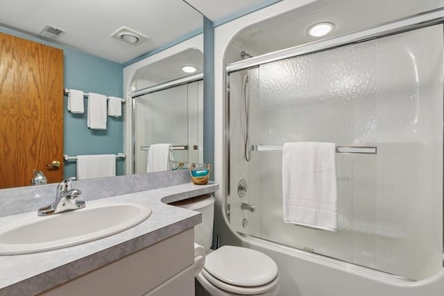 10059 Weko Dr, Bridgman, MI 49106 - bathroom featuring enclosed tub / shower combo, toilet, and vanity