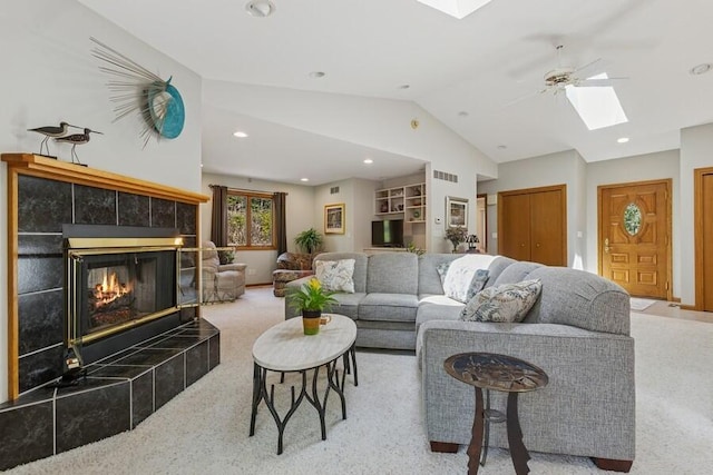10059 Weko Dr, Bridgman, MI 49106 - carpeted living room featuring a skylight, vaulted ceiling, a fireplace, recessed lighting, and a ceiling fan