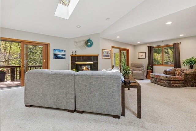 10059 Weko Dr, Bridgman, MI 49106 - living room featuring carpet floors, healthy amount of natural light, recessed lighting, a tile fireplace, and vaulted ceiling