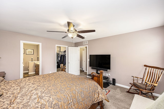 754 Autumn Valley Dr, Ortonville, MI 48462 - bedroom featuring a spacious closet, a closet, baseboards, carpet, and connected bathroom