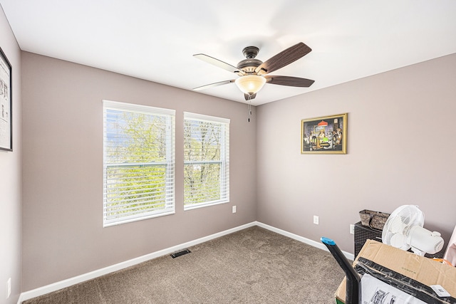 754 Autumn Valley Dr, Ortonville, MI 48462 - home office featuring baseboards, a ceiling fan, and carpet