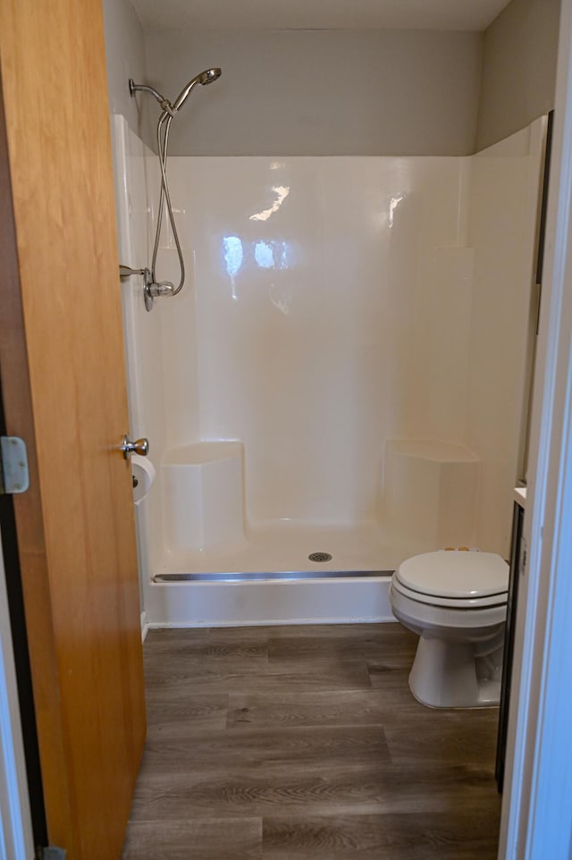 45762 Prairiegrass Ct Unit 7, Michigan, MI 48111 - full bath with walk in shower, wood finished floors, and toilet