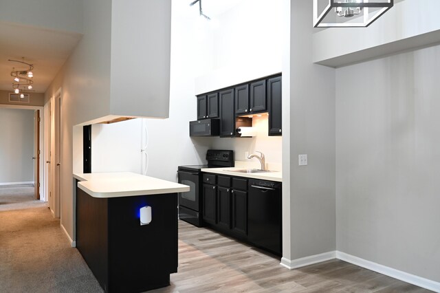 45762 Prairiegrass Ct Unit 7, Michigan, MI 48111 - kitchen with black appliances, a sink, dark cabinets, light countertops, and a high ceiling