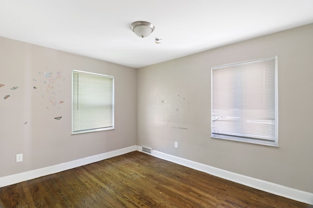 14643 Penrod St, Detroit, MI 48223 - spare room featuring baseboards and dark wood-style flooring