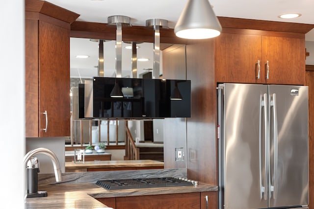 34052 Lotties Dr, Chesterfield, MI 48047 - kitchen with freestanding refrigerator, brown cabinets, and recessed lighting