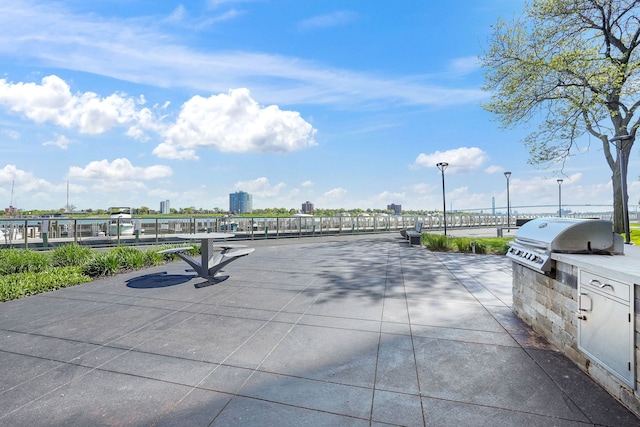 300 Riverfront Dr Unit 300/4C, Detroit, MI 48226 - view of patio / terrace featuring area for grilling and an outdoor kitchen