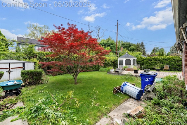 441 Parkview Dr, Detroit, MI 48214 - view of grassy yard featuring a gazebo and a patio