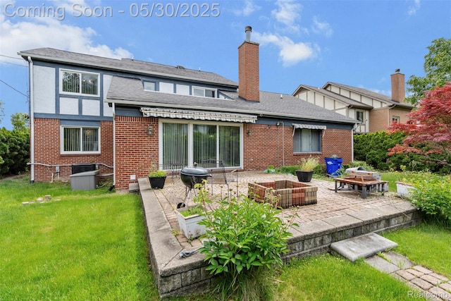 441 Parkview Dr, Detroit, MI 48214 - back of property featuring a patio, brick siding, a chimney, a lawn, and an outdoor fire pit