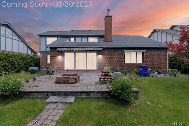 441 Parkview Dr, Detroit, MI 48214 - rear view of house with an outdoor fire pit, a patio area, a chimney, a yard, and brick siding
