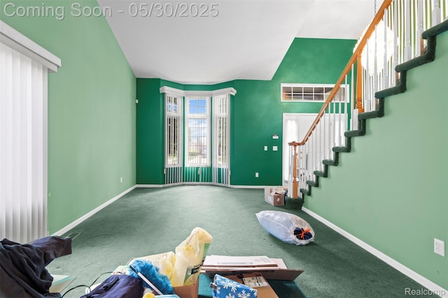 441 Parkview Dr, Detroit, MI 48214 - unfurnished living room featuring carpet, baseboards, stairway, and lofted ceiling