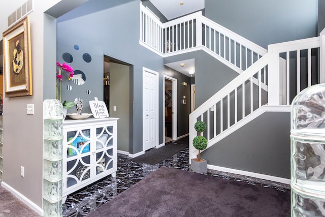 2761 Tomahawk Dr, Waterford, MI 48328 - entrance foyer featuring marble tiled flooring, stairway, and baseboards