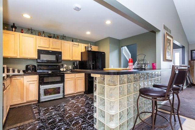 2761 Tomahawk Dr, Waterford, MI 48328 - kitchen with black appliances, light brown cabinetry, recessed lighting, dark countertops, and a breakfast bar area
