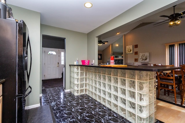 2761 Tomahawk Dr, Waterford, MI 48328 - bar with black fridge, ceiling fan, baseboards, recessed lighting, and dark marble finish flooring