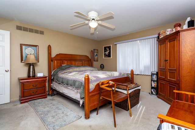2761 Tomahawk Dr, Waterford, MI 48328 - bedroom with light colored carpet, ceiling fan, and baseboards