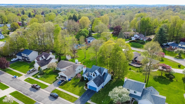 2761 Tomahawk Dr, Waterford, MI 48328 - aerial view of residential area with a heavily wooded area