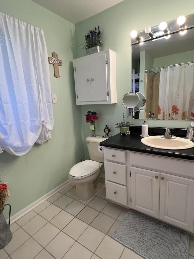 full bath with toilet, vanity, baseboards, and tile patterned floors