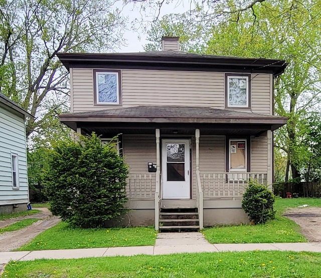 1123 Mills St, Kalamazoo, MI 49001 - traditional style home with a porch and a chimney