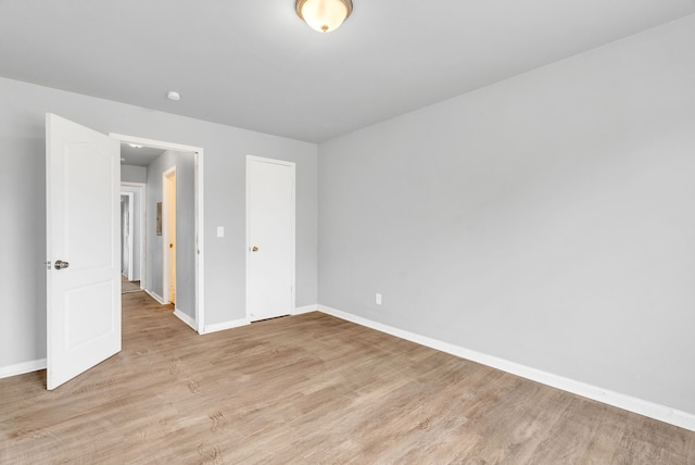 18250 Weaver St, Detroit, MI 48228 - unfurnished bedroom featuring baseboards, light wood finished floors, and a closet