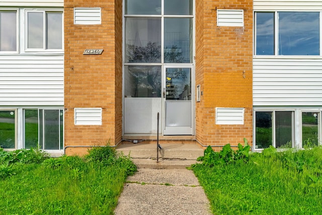 18250 Weaver St, Detroit, MI 48228 - property entrance featuring brick siding