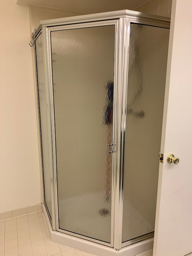 bathroom featuring a stall shower and tile patterned floors