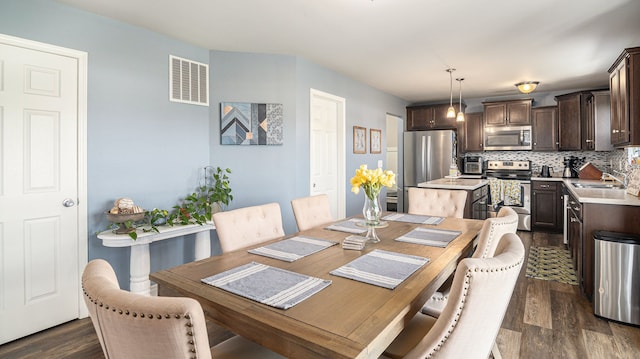 3242 Hill Hollow Ln, Howell, MI 48855 - dining space with dark wood-style flooring