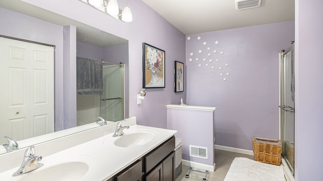 3242 Hill Hollow Ln, Howell, MI 48855 - full bathroom with a stall shower, double vanity, baseboards, and tile patterned flooring