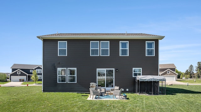 3242 Hill Hollow Ln, Howell, MI 48855 - rear view of house featuring a yard and a patio