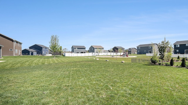 3242 Hill Hollow Ln, Howell, MI 48855 - view of yard with a residential view and a playground