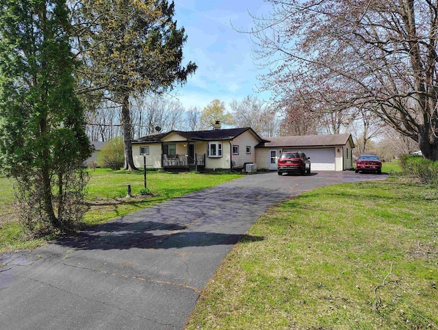 7250 Riegler St, Grand Blanc, MI 49438 - ranch-style house featuring driveway, a front yard, a chimney, and a garage