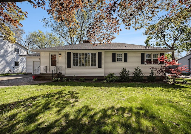 615 Garber Rd, North Muskegon, MI 49445 - single story home with a garage and a front yard