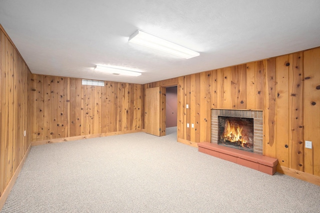 615 Garber Rd, North Muskegon, MI 49445 - finished basement with carpet, a fireplace, wood walls, and baseboards
